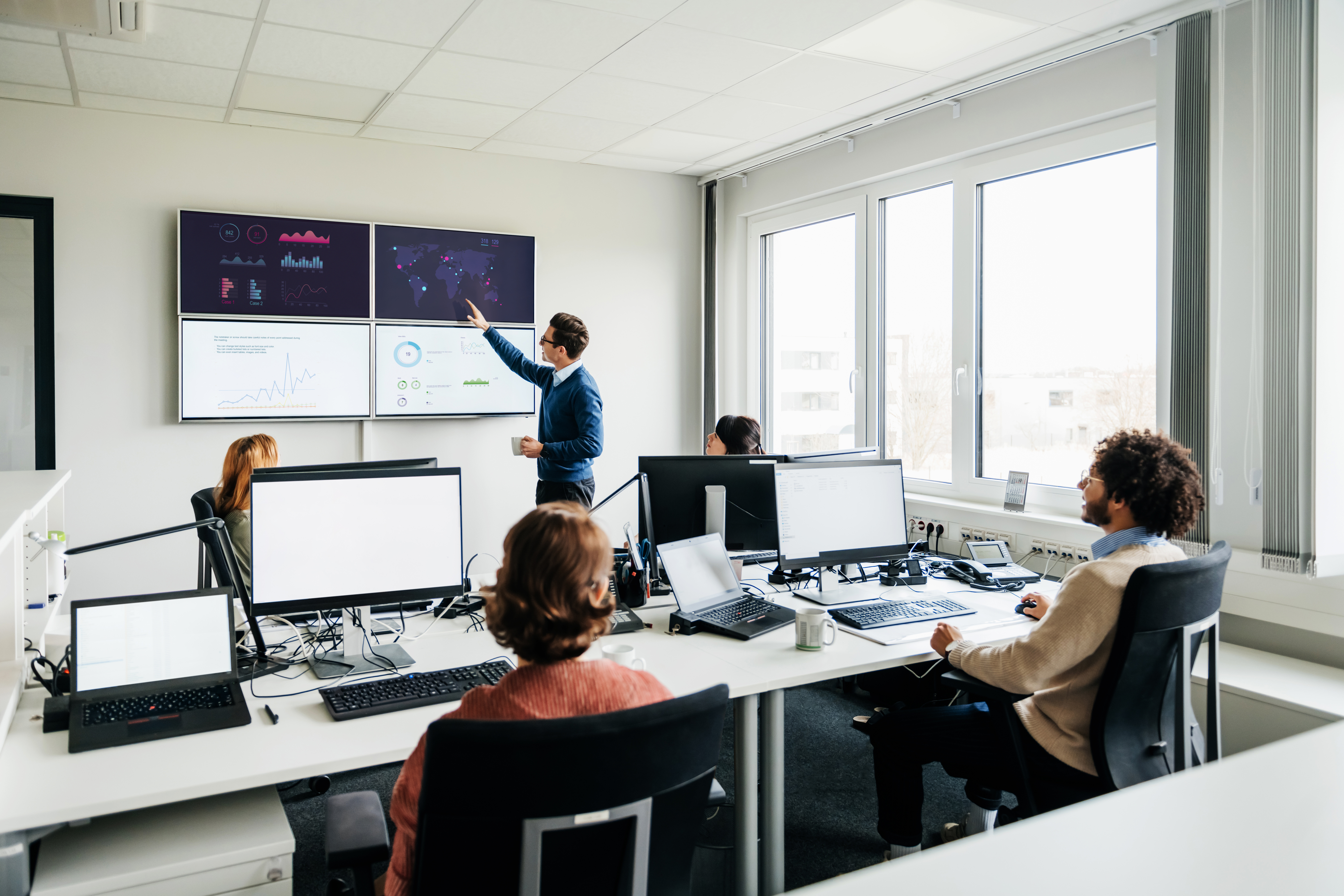 A man leading a discussion about data analytics.