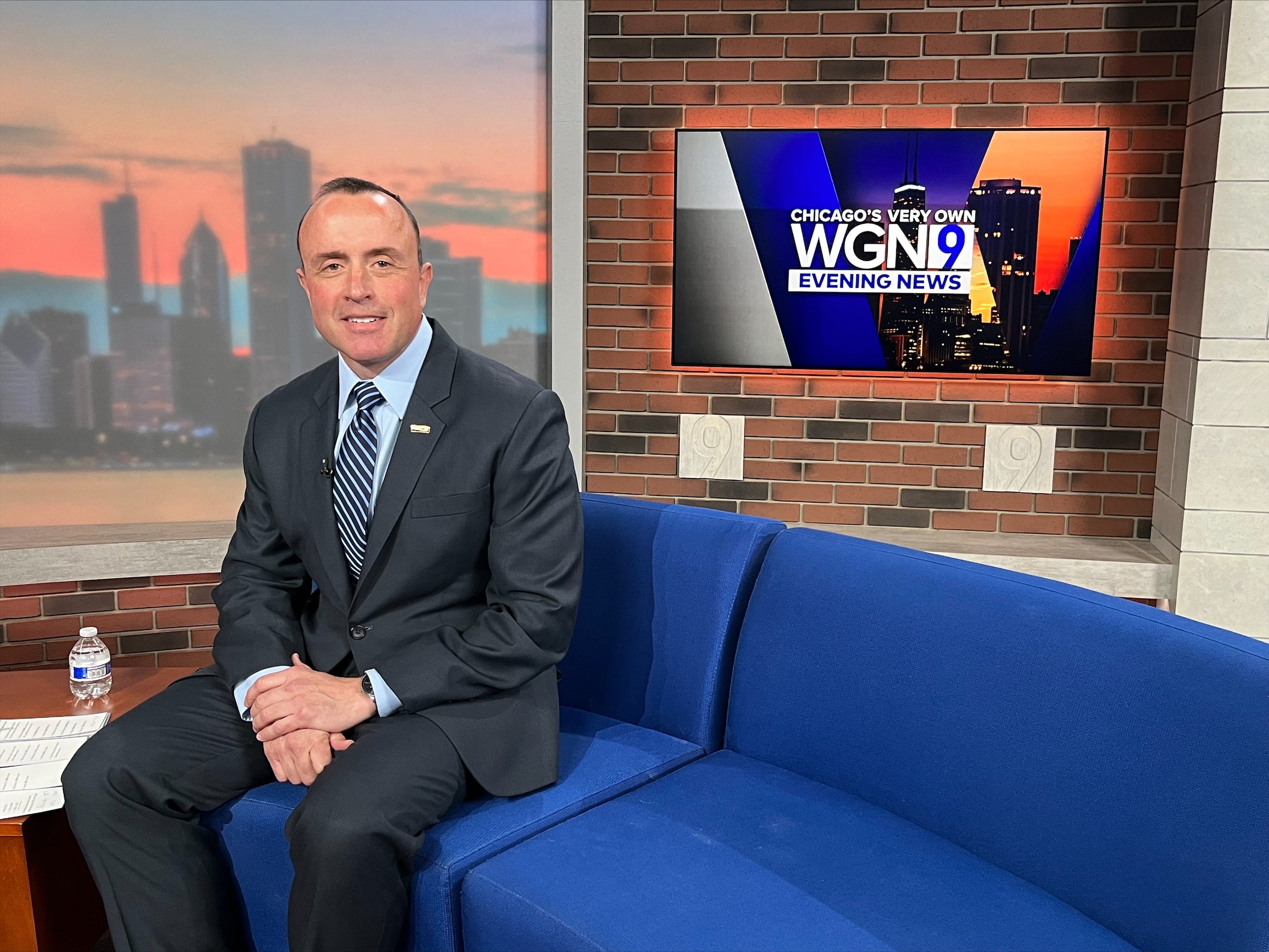 Man on set of local news 