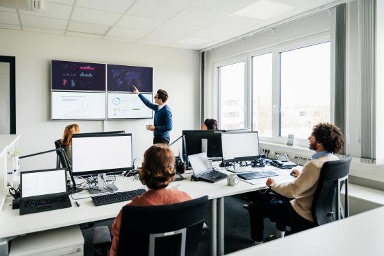A man leading a discussion about data analytics.